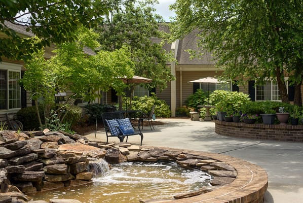 Outdoor courtyard with seating and a fountain