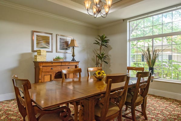 Interior dining room with a wooden table and chairs