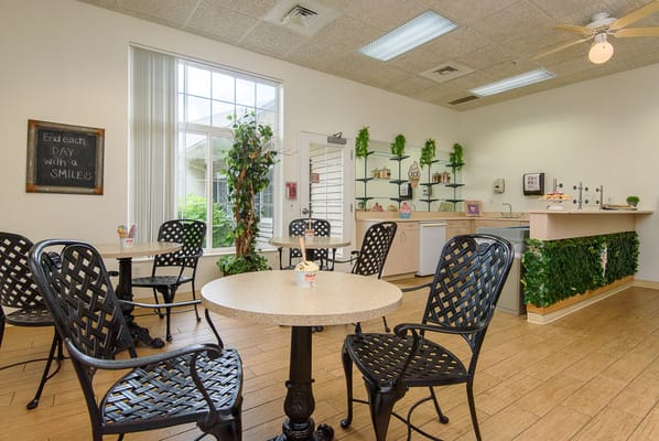 Bright common area with seating and plants