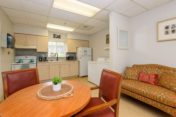 Cozy kitchenette area with a couch and dining table