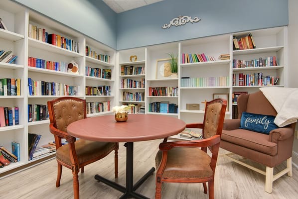 Bright common area with bookshelves and seating