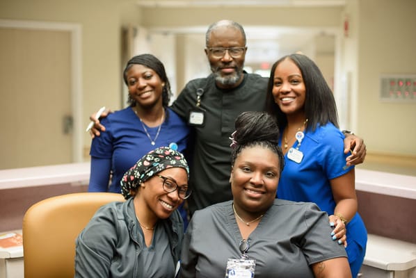 Staff members gathered in a vibrant common area