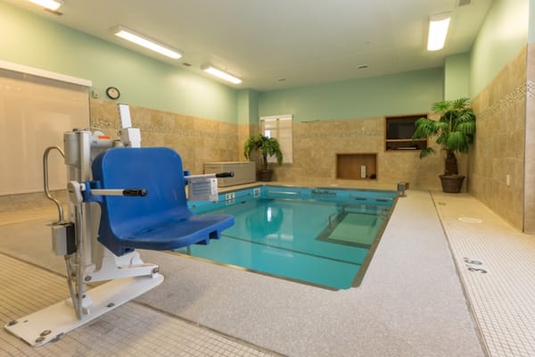 Indoor pool area with accessibility lift