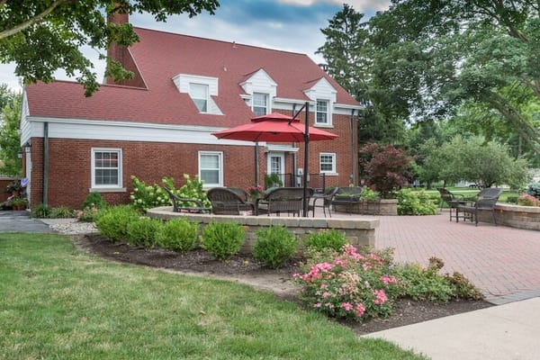 Outdoor seating area with gardens at the facility