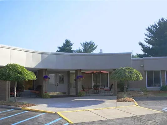Building exterior with seating area and landscaping