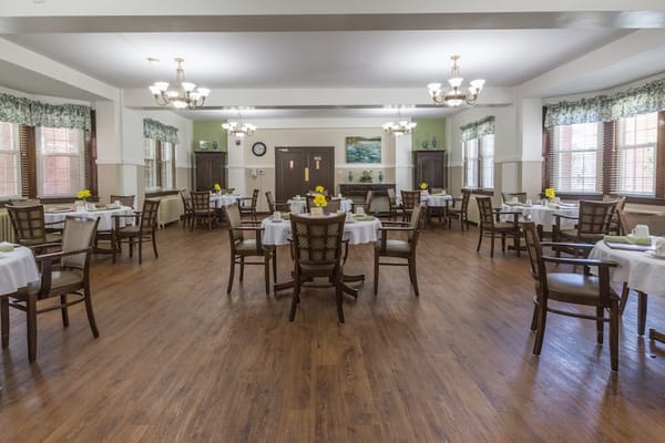 Interior dining area with tables and flowers