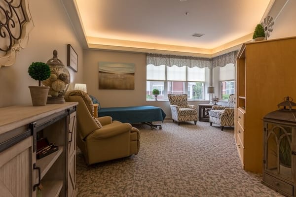 A cozy resident room with comfortable furniture