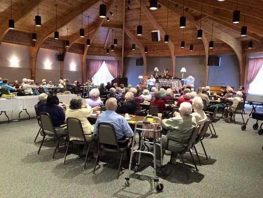 Residents participating in an activity in a community hall