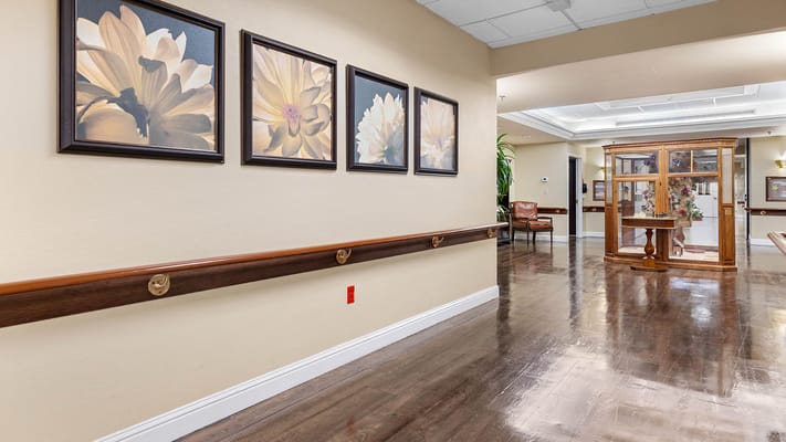 Interior corridor with floral artwork and seating