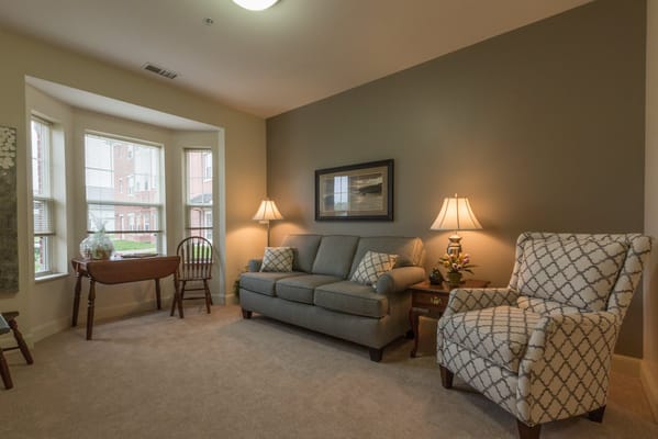 Cozy interior lounge area with a sofa and chairs