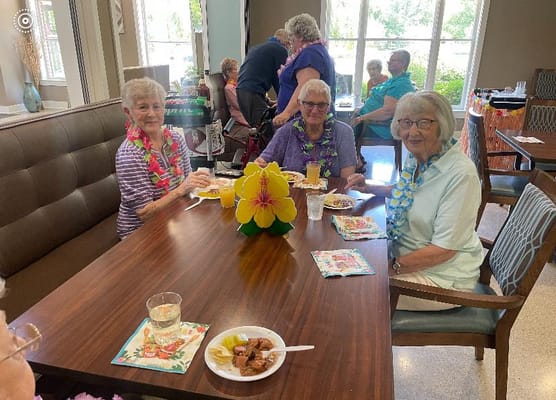 Residents enjoying a meal together in a common area