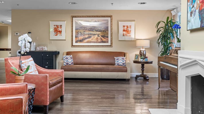 Cozy common area with seating and piano