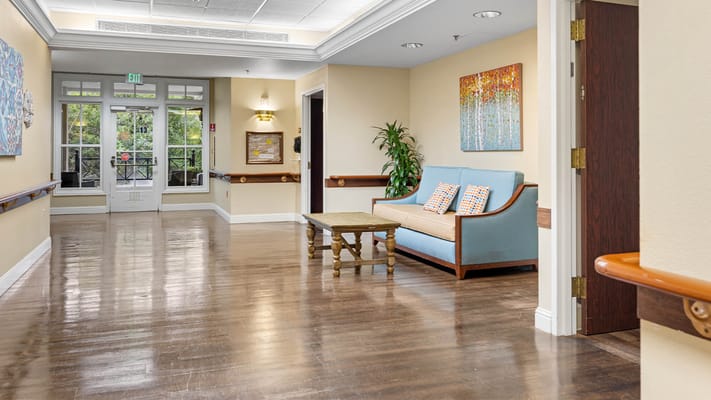 Bright common area with seating and artwork