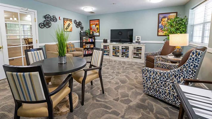 Bright common area with seating and entertainment options