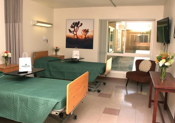 Private resident room with beds and a view