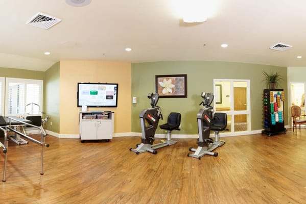 Interior view of a fitness area with exercise equipment