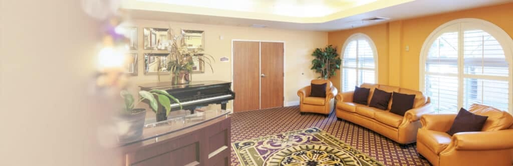 Interior lounge area with piano and seating