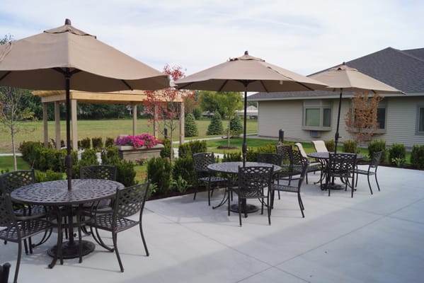 Outdoor patio space with tables and umbrellas