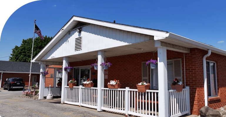 Exterior view of Windsor House at Champion with flower pots