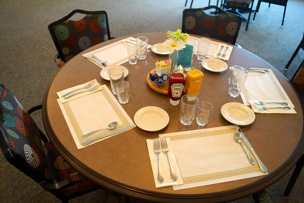 Dining table set with plates and condiments