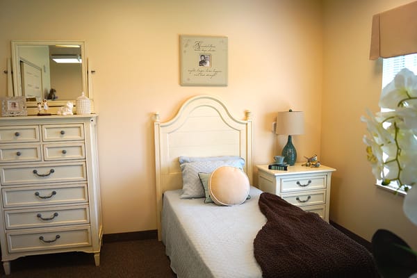 A cozy bedroom in the assisted living facility