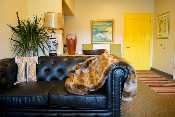 Warm, inviting lounge area with cozy couch