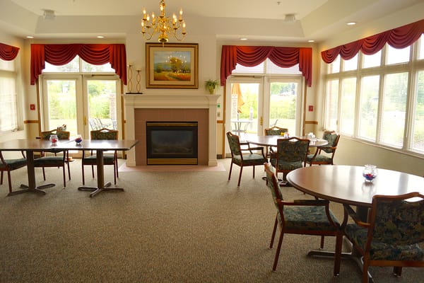 Bright common area with tables and chairs