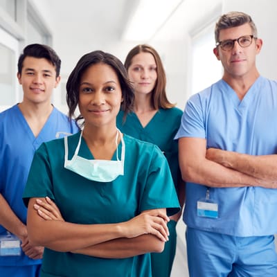 Healthcare staff posing in a corridor