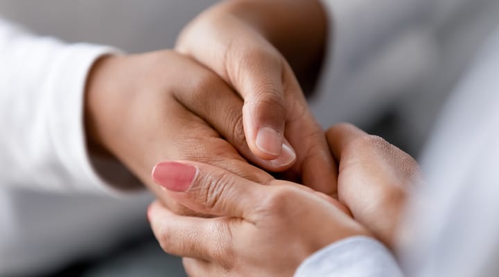 Close-up of hands showing tenderness and support