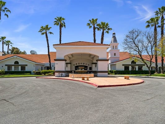 Exterior view of Westmont Village Homes with palm trees