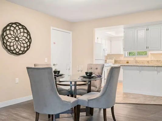 Modern dining area with a round table and chairs