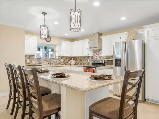 Bright kitchen with seating and modern appliances