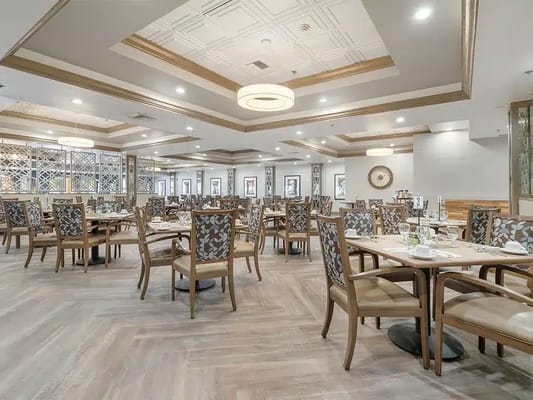 Elegant dining room with tables set for meals