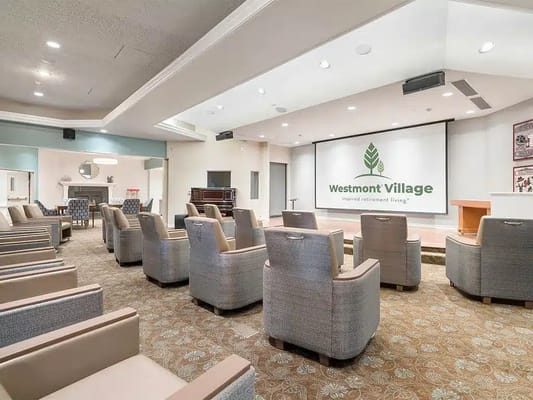 Common area with seating and a presentation screen