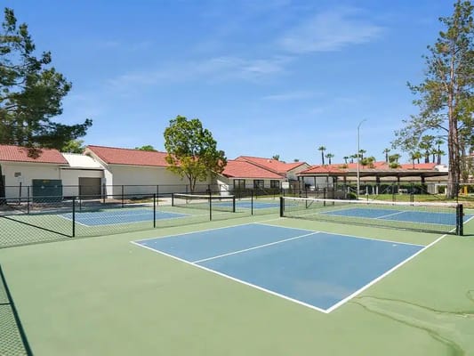 Tennis courts surrounded by resident buildings