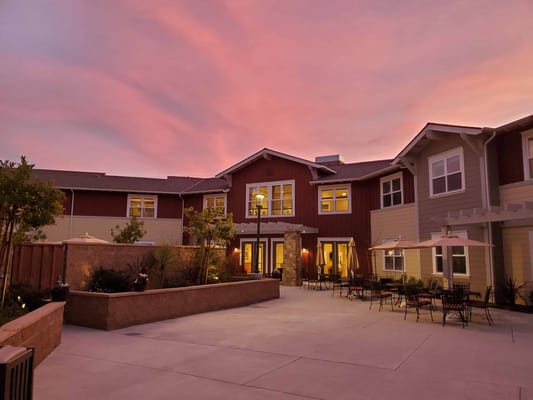Exterior view of the facility at sunset