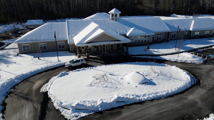 Aerial view of Woodlands Memory Care building in winter