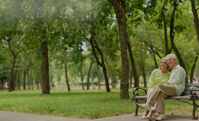 A couple enjoying time together on a park bench
