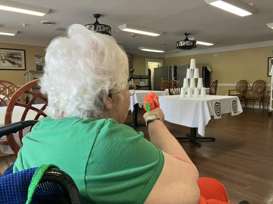 Resident participating in an activity inside the facility