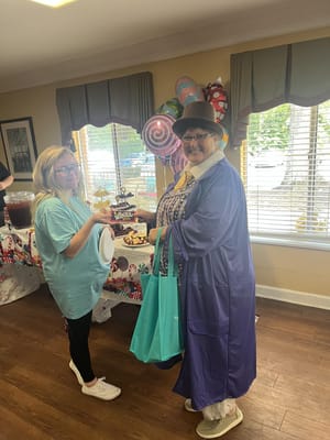 Residents celebrating with food and decorations in a common area