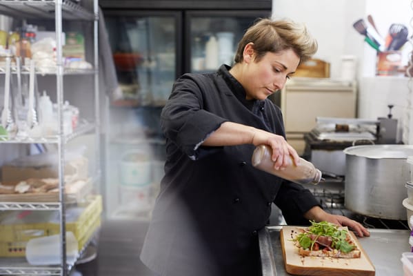 A chef preparing a healthy dish in the kitchen