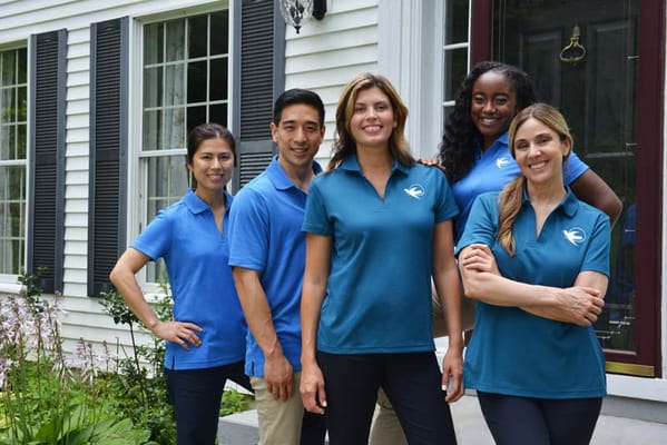 Staff members standing outside the assisted living facility
