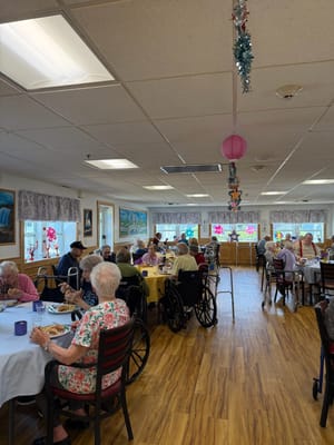 Residents enjoying meals in a dining room