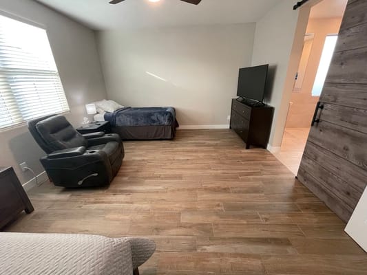 Private resident room with furniture and television