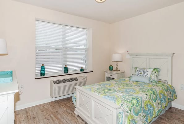Cozy resident bedroom with a colorful bedspread