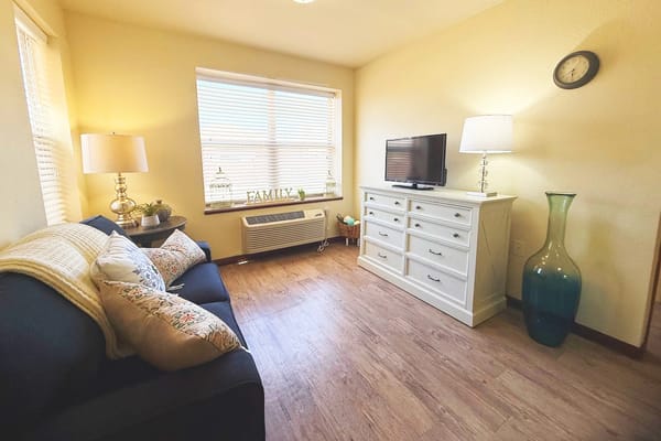 Cozy sitting area with a sofa and television