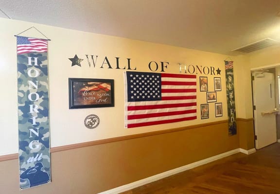 Wall of Honor featuring flags and patriotic decor