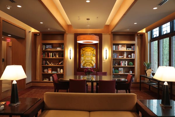 Cozy common area with bookshelves and seating