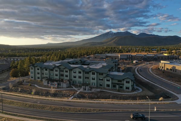 Aerial view of Highgate Senior Living facility with mountains