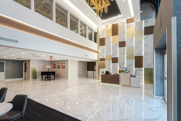 Modern lobby of a healthcare facility with marble floors